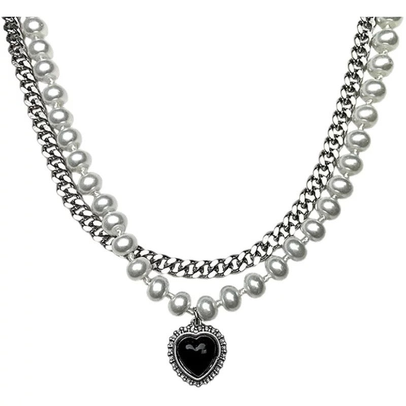 Damen Halskette mit glamourösem Herzanhänger und eleganten Perlendetails Shop Nory