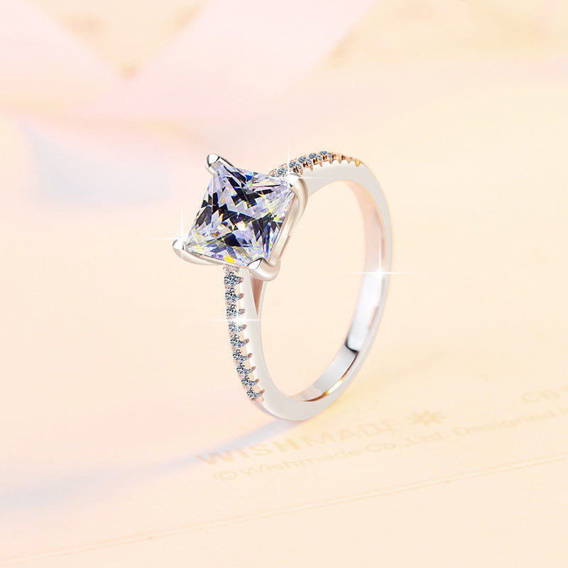 Damen Verlobungsring mit funkelndem quadratischem Zirkonia und filigranem Design Shop Nory