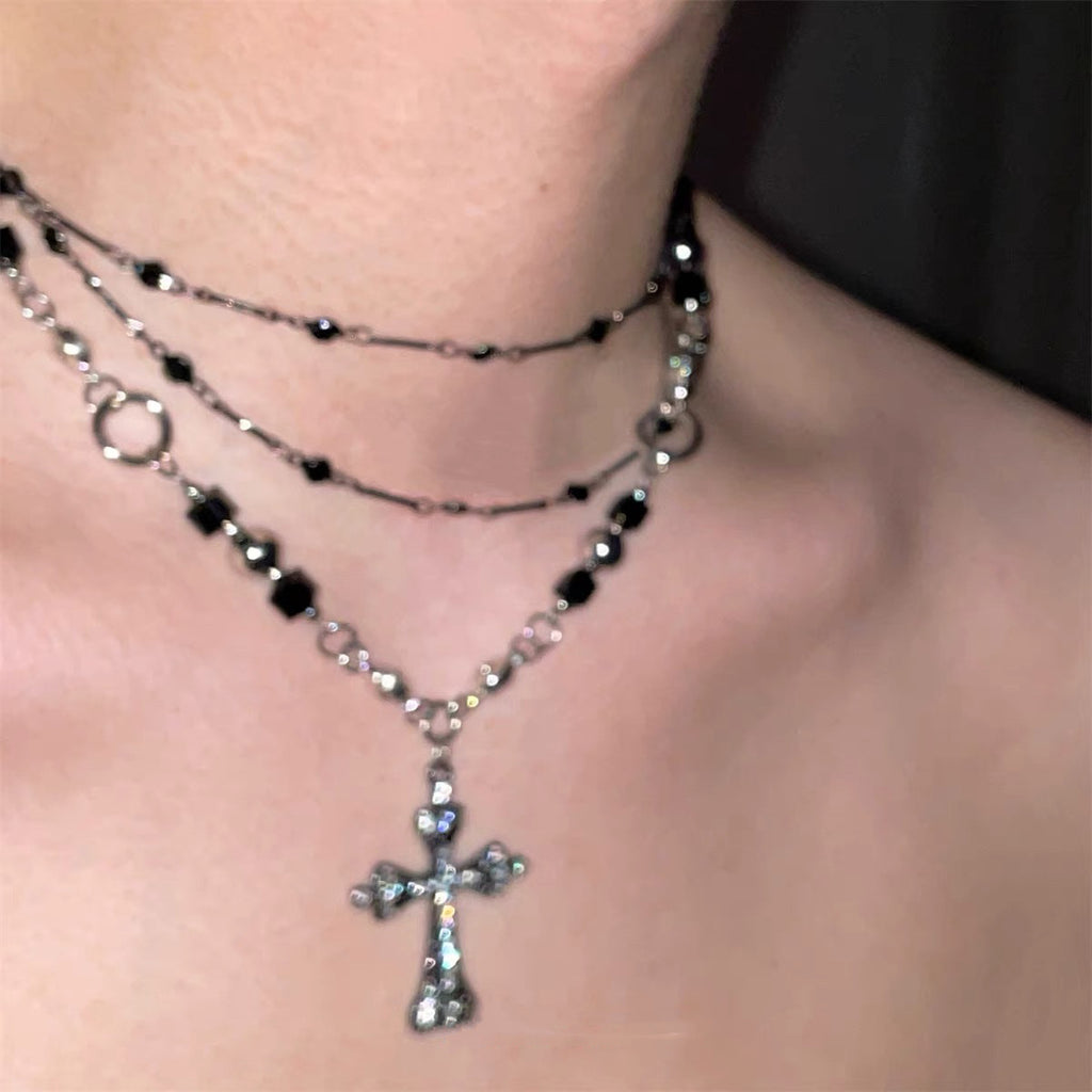 Damen mehrlagige Kette mit funkelndem Kreuzanhänger und eleganten Gliederkettendetails Shop Nory
