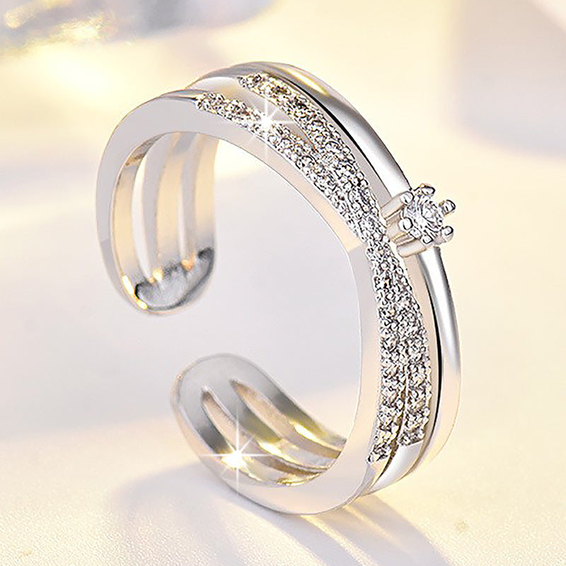 Damen Offener Ring mit funkelnden Zirkonia-Elementen und kunstvollem Design Shop Nory