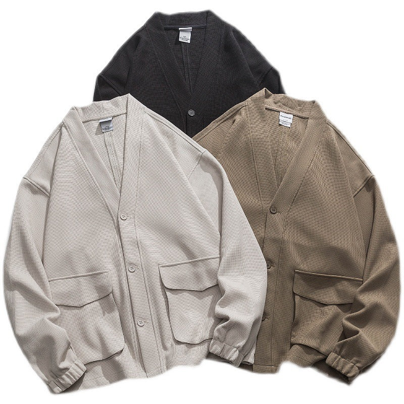 Unisex Oversize-Strickjacke mit großen Klappentaschen und Waffelstruktur Shop Nory