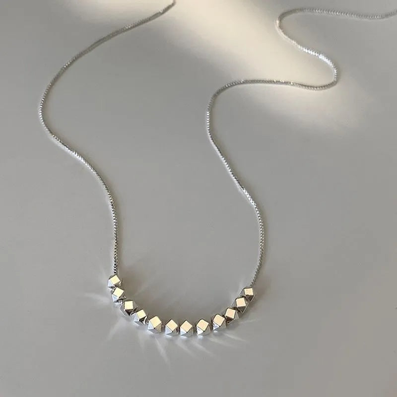 Damen Halskette mit geometrischen, glänzenden Kubelementen Shop Nory