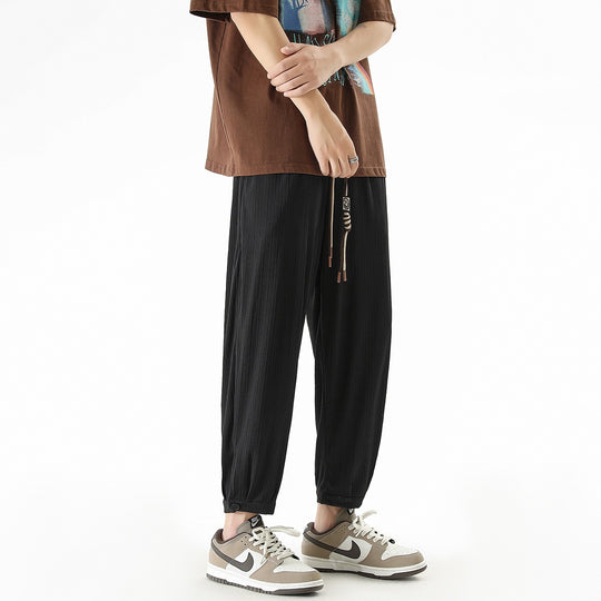 Herren Weit geschnittene Freizeithose mit Tunnelzug, feiner Rippenstruktur und geknöpften Beinbündchen Shop Nory