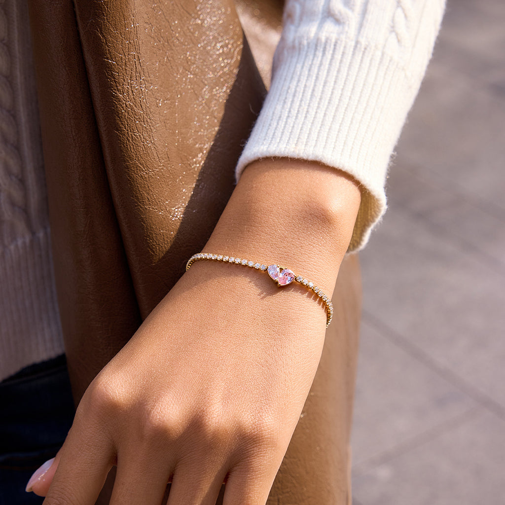Damen Armband mit funkelnden Zirkonia und herzförmigem Anhänger Shop Nory