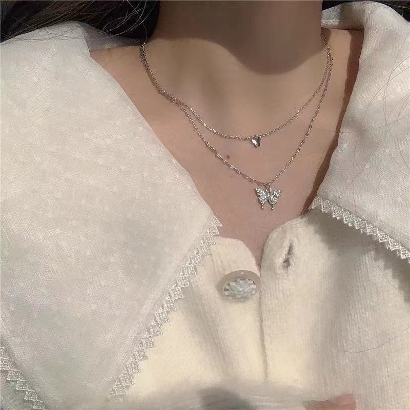 Damen Halskette mit funkelndem Schmetterlingsanhänger aus hochwertigem Edelstahl Shop Nory