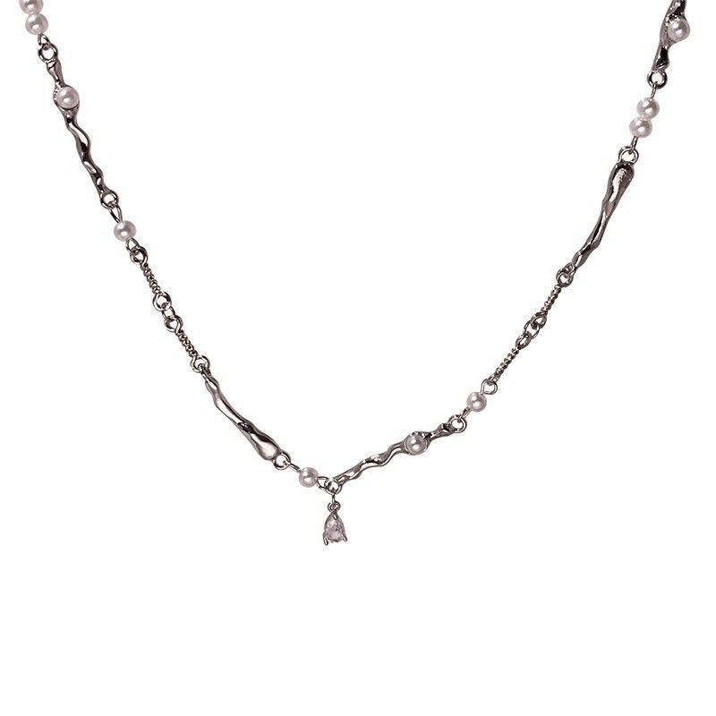 Damen Armband mit eleganten Perlen und geschwungenen Elementen Shop Nory