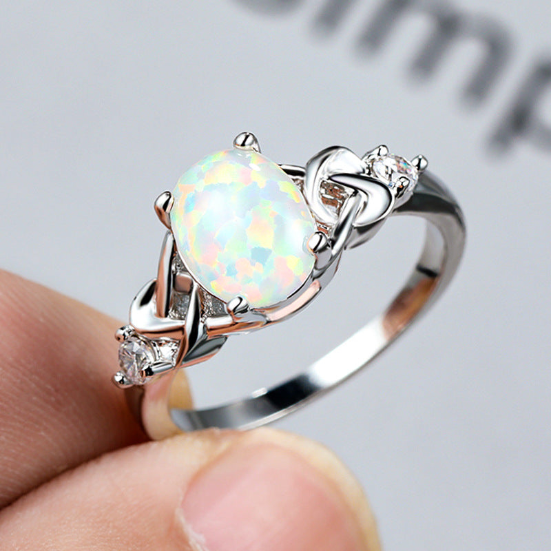 Damen Ring mit funkelndem Opalschmuck und kunstvollen Zirkonia-Details Shop Nory