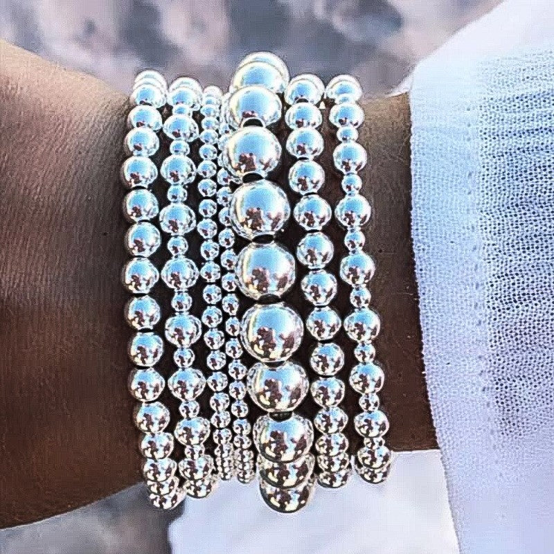 Damen Armband-Set mit funkelnden Perlen und eleganten Details Shop Nory