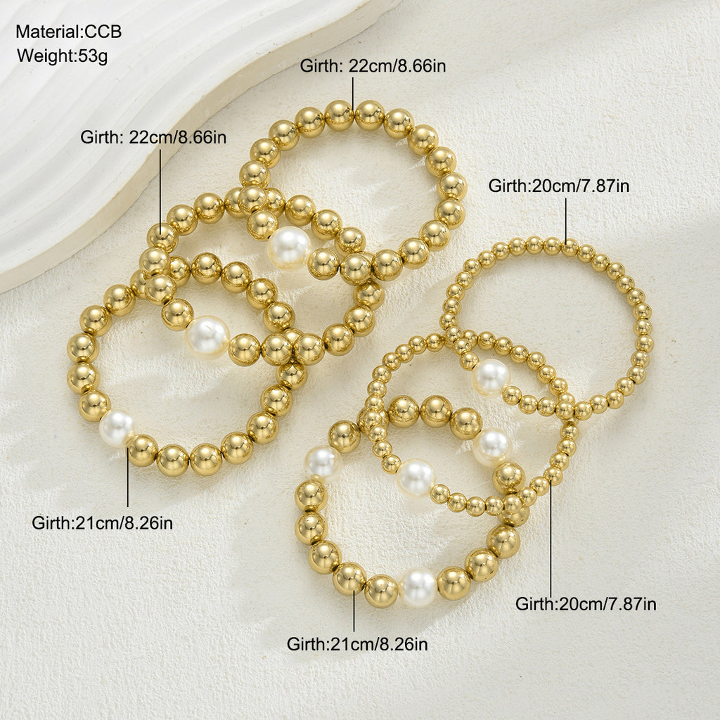 Damen Armband-Set mit glänzenden Perlen und goldenen Akzenten Shop Nory