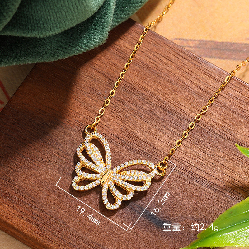 Damen Halskette mit filigranem Schmetterlingsanhänger und funkelnden Zirkonia Shop Nory