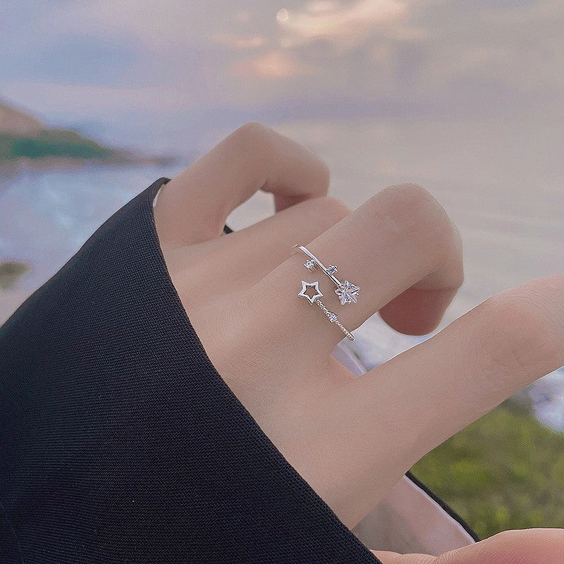 Damen eleganter und zarter Ring mit Stern- und Blütenmotiven Shop Nory