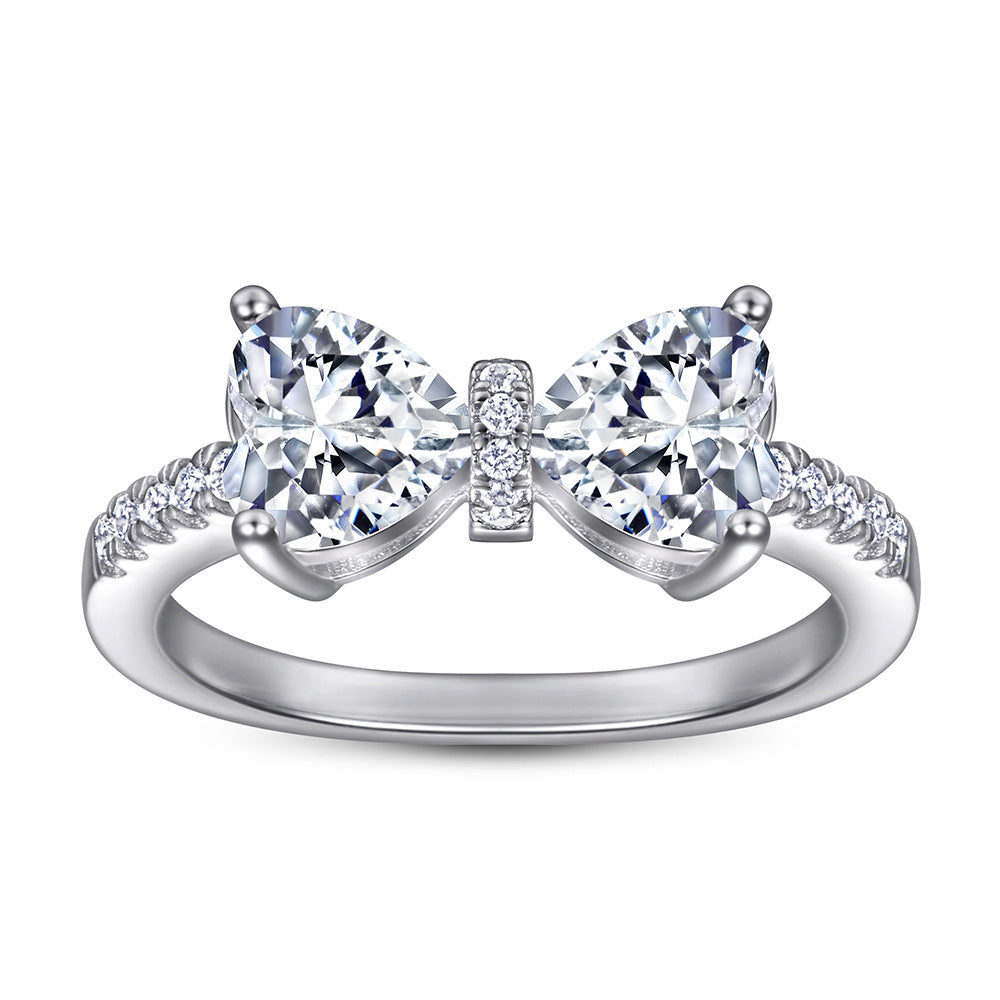 Damen Designer-Ring mit Schleifenmotiv und funkelnden Zirkonia Shop Nory