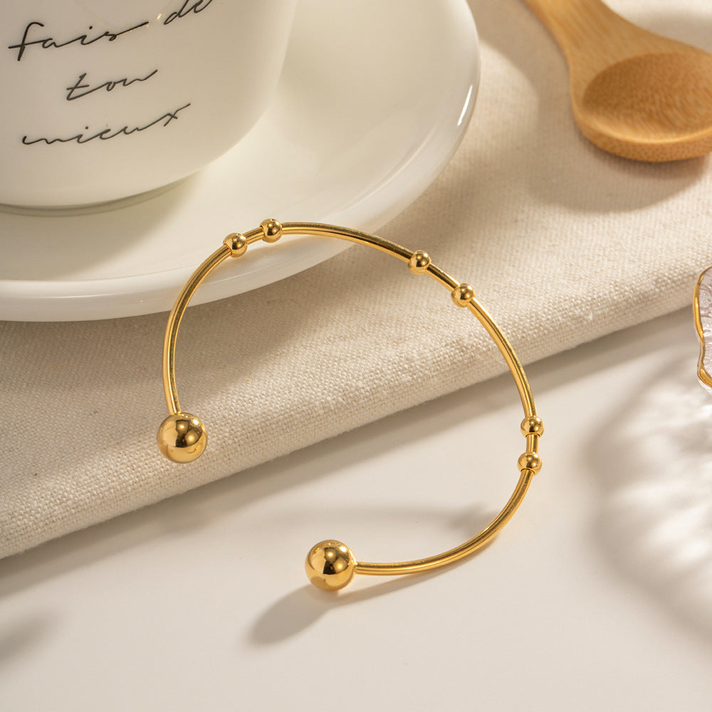 Damen Offenes Armreif mit elegantem Spiral-Design und Goldakzenten Shop Nory