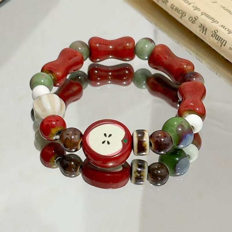 Damen Armband aus handgefertigten bunten Naturperlen und stilvollen Anhängern Shop Nory
