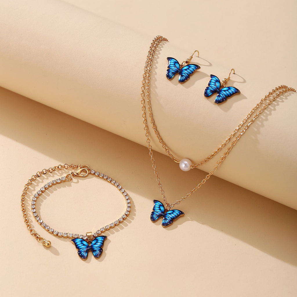 Damen Schmuckset mit schimmernden Schmetterlingsanhängern und funkelnden Elementen Shop Nory