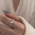 Damen herzförmiger Silberring mit elegantem Drehdesign Shop Nory