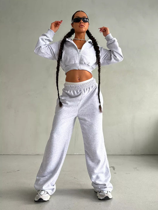 Damen kurzes Zip-Kapuzensweatshirt mit tailliertem Bündchen und weitem High‑Waist French‑Terry Jogginghose Set Shop Nory