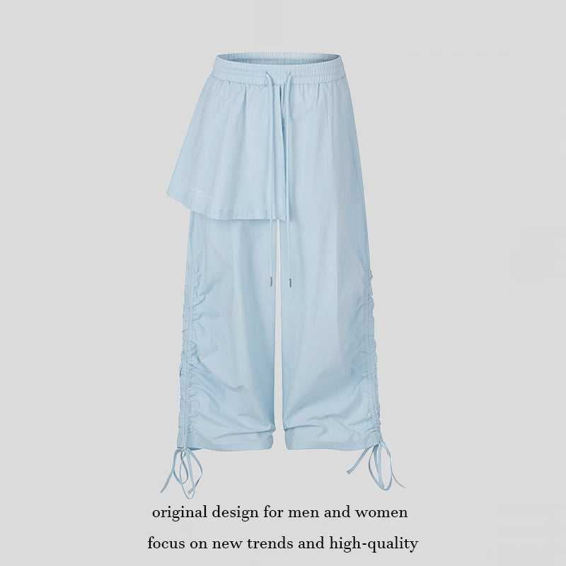 Damen Weite Capri-Hose mit Tunnelzug, seitlicher Raffung und asymmetrischer Überlagerung Shop Nory
