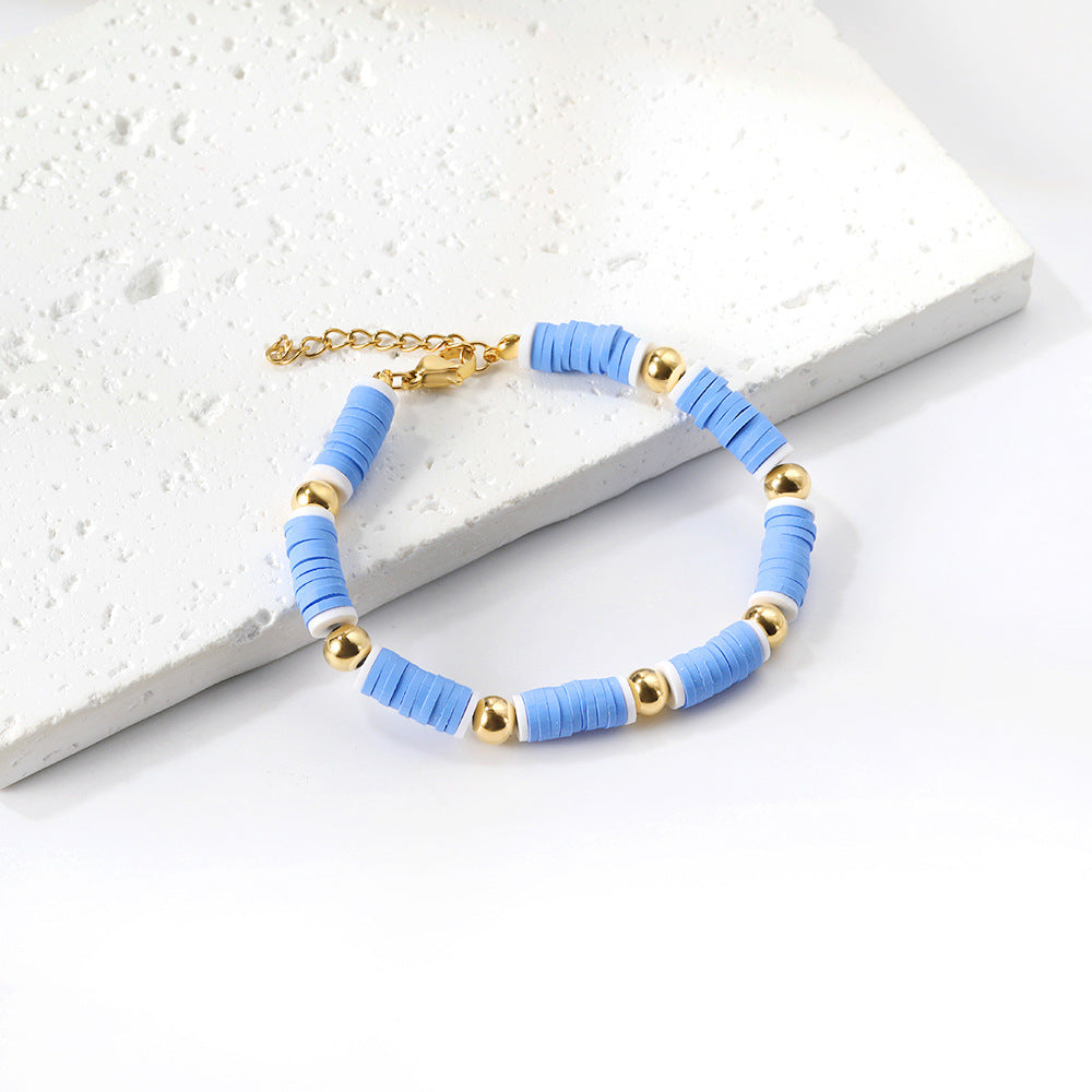 Damen Armband aus hochwertigem Edelstahl mit bunten Perlen und goldplattierten Akzenten Shop Nory