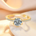 Damenring mit funkelndem Zirkonia und eleganten Goldverzierungen Shop Nory