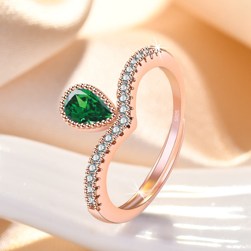 Damenring mit tropfenförmigem grünem Edelstein und Zirkonia-Besatz Shop Nory