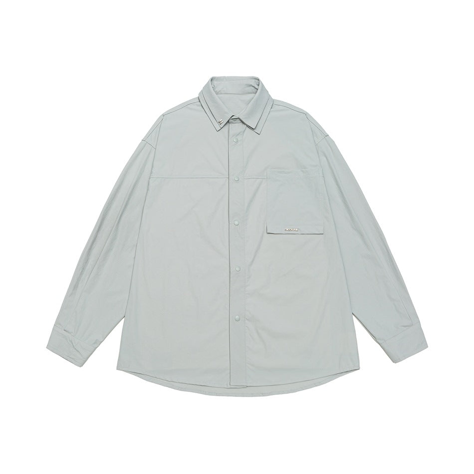 Unisex Oversize Hemd mit technischem Material, Brustklappe und gerundetem Saum Shop Nory