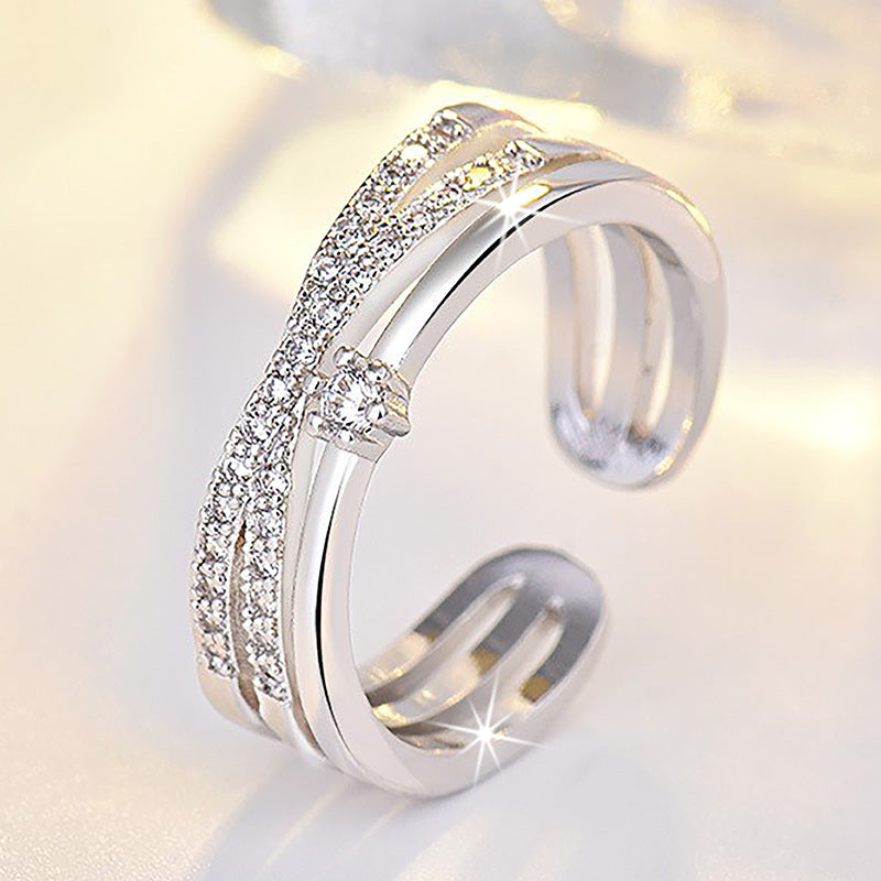 Damen Offener Ring mit funkelnden Zirkonia-Elementen und kunstvollem Design Shop Nory