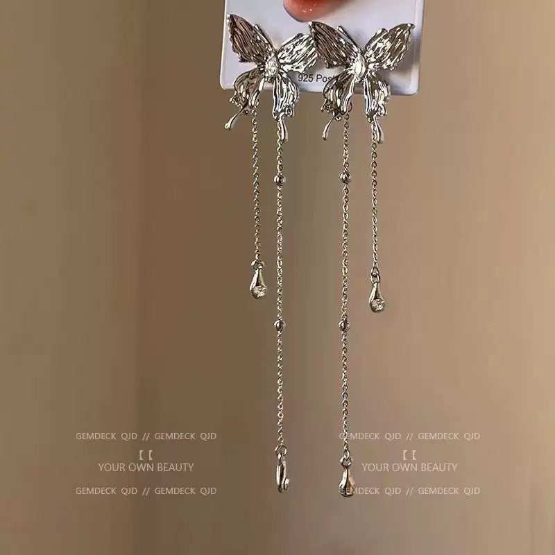 Damen Ohrringe im eleganten Schmetterlingsdesign mit funkelnden Kristallakzenten Shop Nory