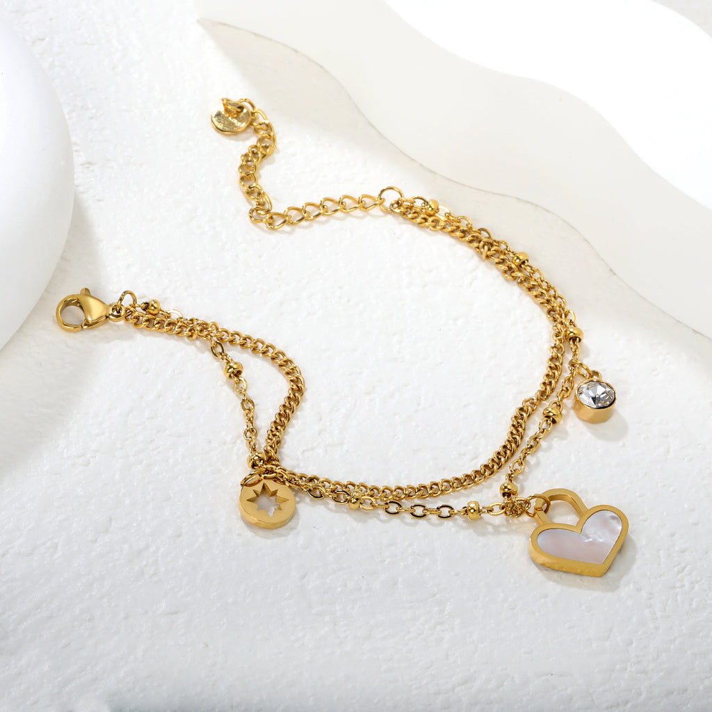 Damen Armband mit Herzen-Anhänger und funkelnden Kristallen Shop Nory