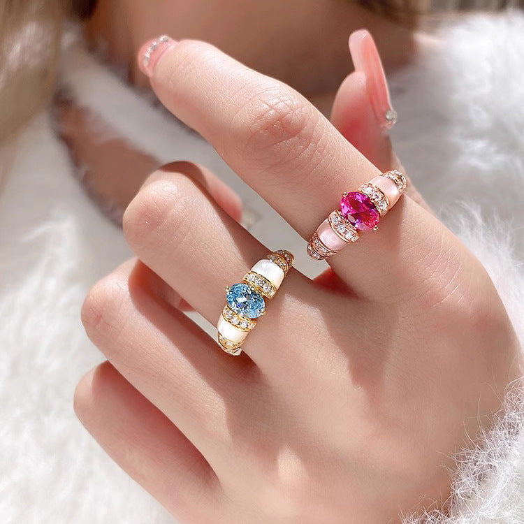 Damenring mit funkelndem Zirkonia und elegantem Perlmuttbesatz Shop Nory