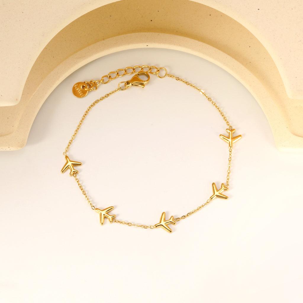 Damen Armband mit stilvollen Flugzeug-Anhängern aus antiallergischem Edelstahl Shop Nory