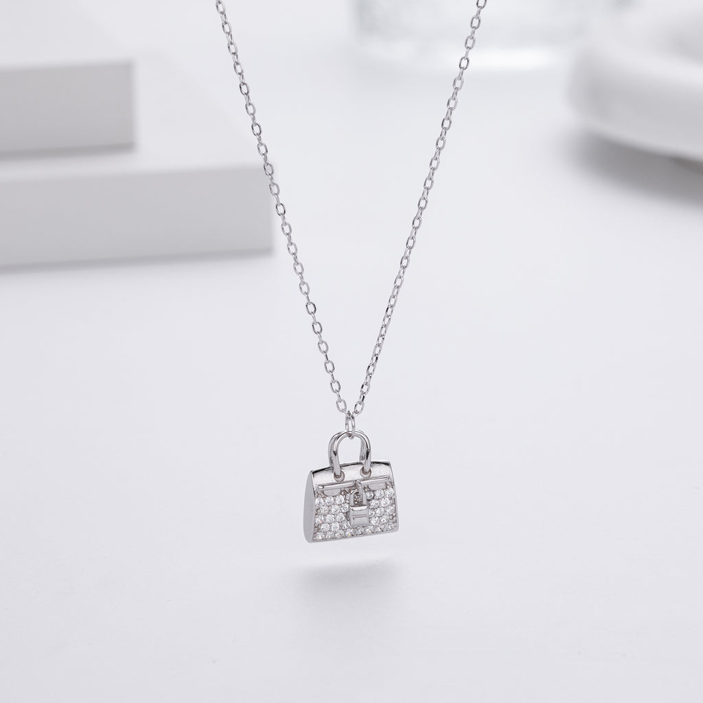 Damen Halskette mit einzigartigem Handtaschenanhänger aus hochwertigem 925 Sterling Silber und funkelnden Zirkonia Shop Nory