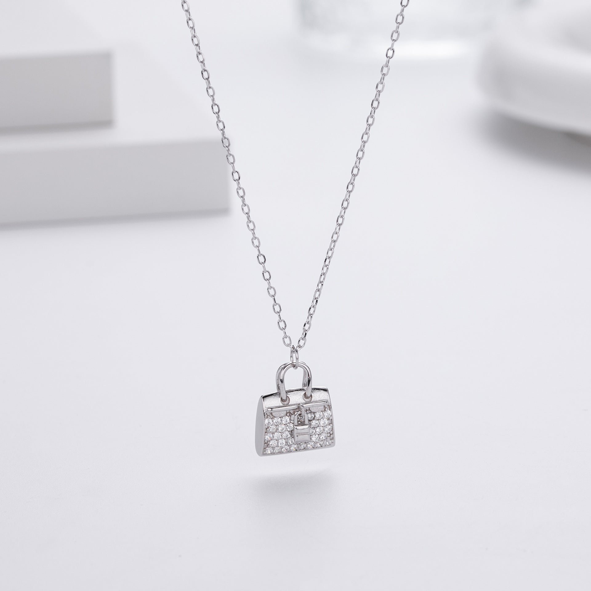 Damen Halskette mit einzigartigem Handtaschenanhänger aus hochwertigem 925 Sterling Silber und funkelnden Zirkonia Shop Nory
