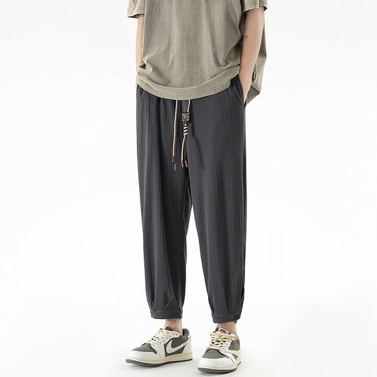 Herren Weit geschnittene Freizeithose mit Tunnelzug, feiner Rippenstruktur und geknöpften Beinbündchen Shop Nory