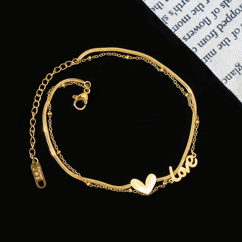 Damen Armkette mit verspieltem Herz- und Schriftzugdesign Shop Nory