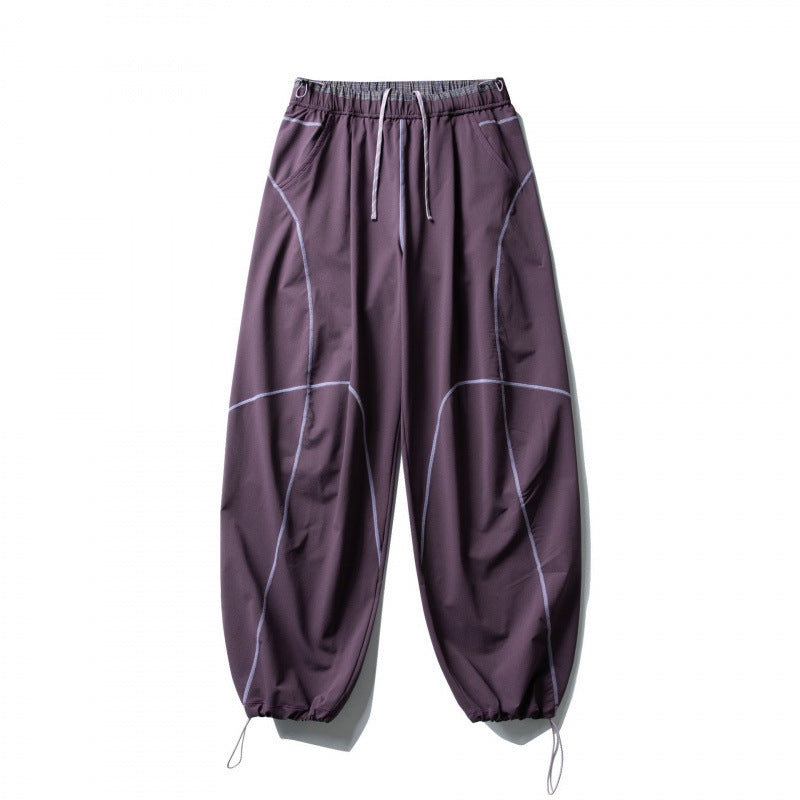 Unisex Locker geschnittene Tech-Jogginghose mit elastischem Bund, markanten Flatlock-Nähten und Kordelzug Shop Nory