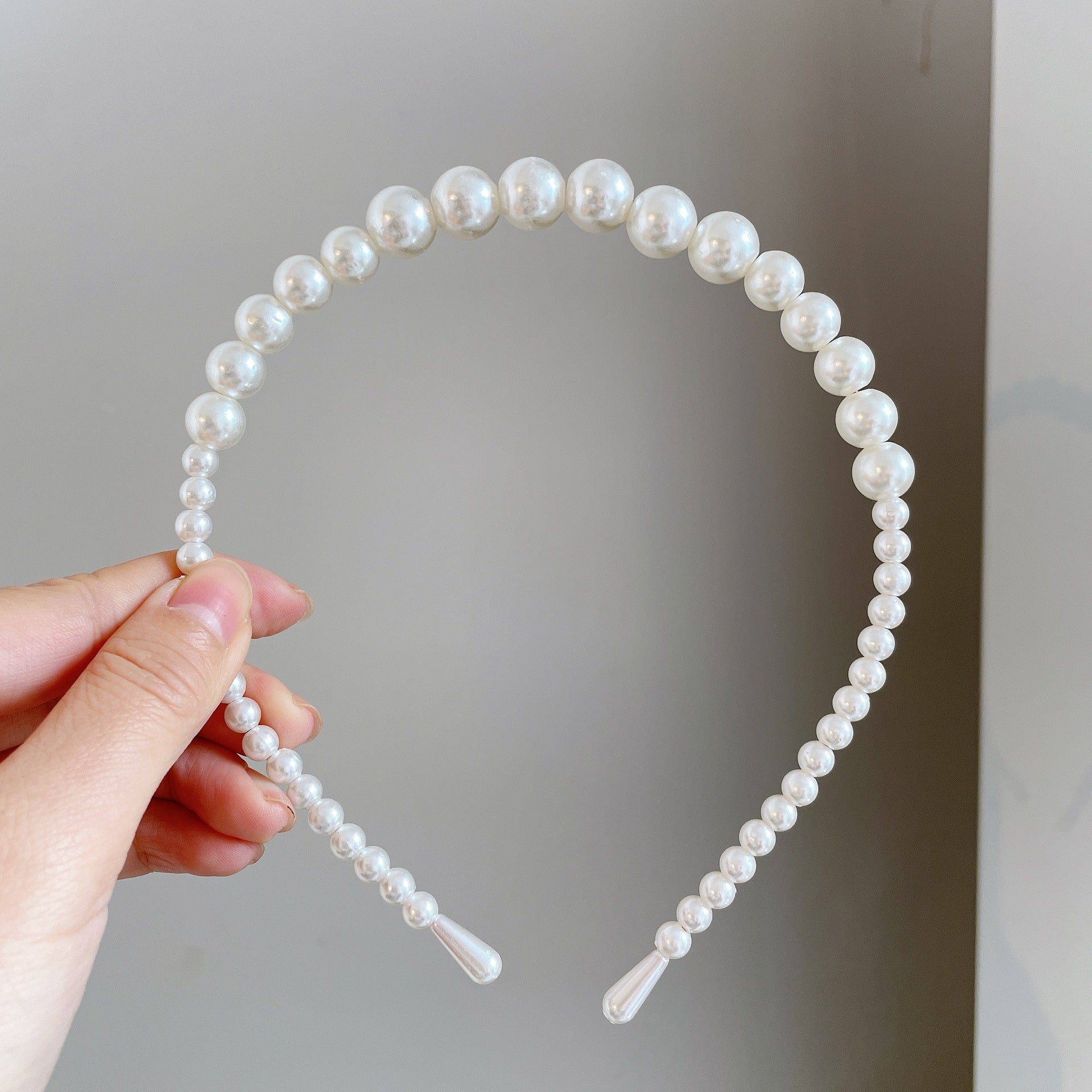 Damen Haarband mit eleganten Perlenakzenten Shop Nory