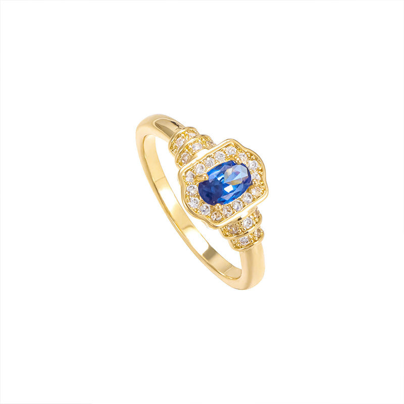 Damenring mit ovalem blauem Edelstein und funkelnden Zirkonia-Steinen Shop Nory