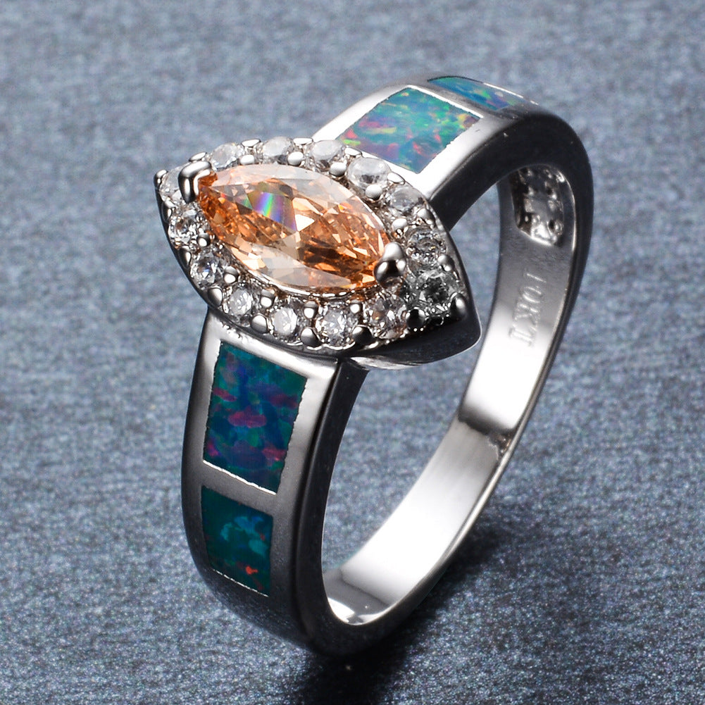 Damen Schmuckring mit funkelndem Zirkonia und schimmernden Opalmosaiken Shop Nory