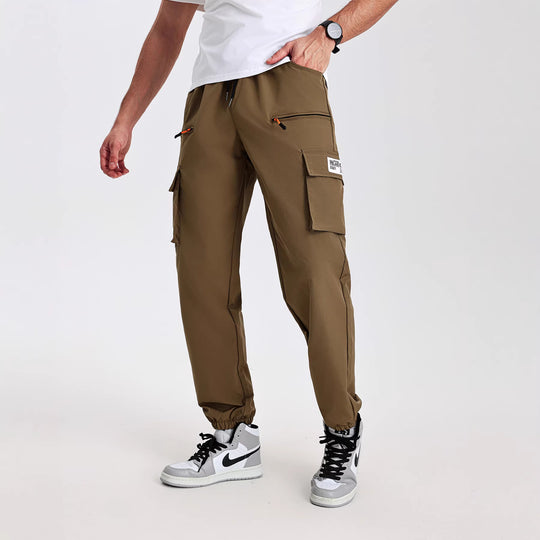 Herren konisch geschnittene Utility-Cargohose im Joggerstil mit Tunnelzugbund, Reißverschlusstaschen & elastischen Beinabschlüssen Shop Nory