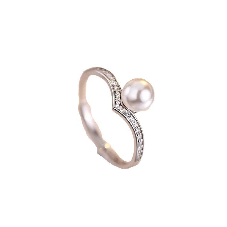 Damen Ring mit modernem geschwungenem Design und Perlenakzent Shop Nory