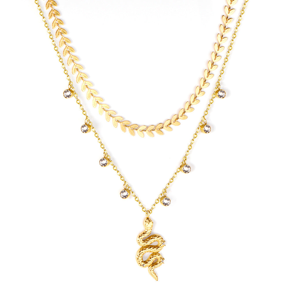 Damen Halskette mit schlangenförmigem Anhänger und goldplattierten Details Shop Nory