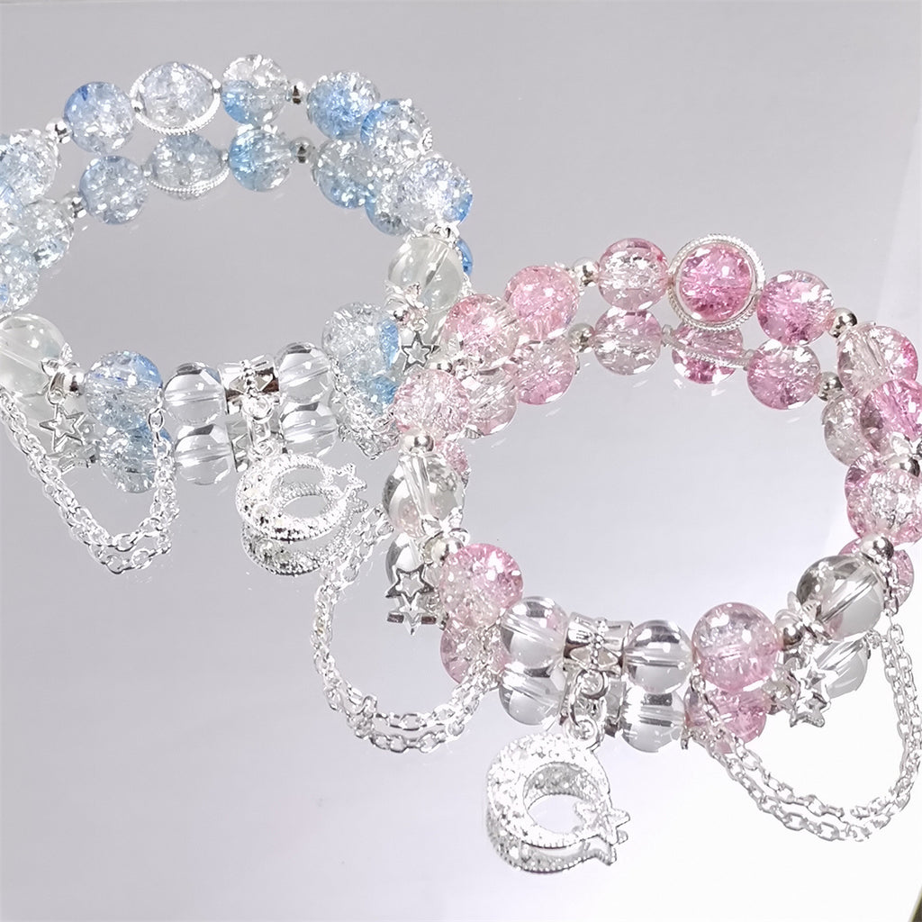 Damen Armband mit funkelnden Kristall-Elementen und charmanten Anhängern Shop Nory