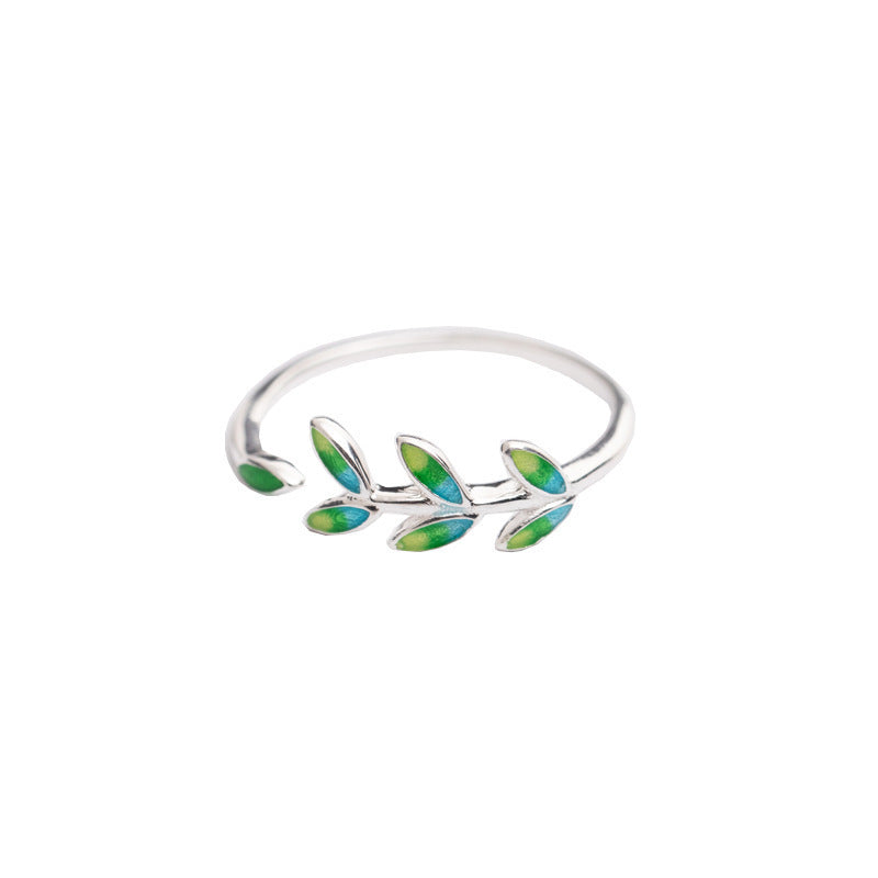 Damenring mit filigranem Blattdesign und opalisierenden Akzenten Shop Nory