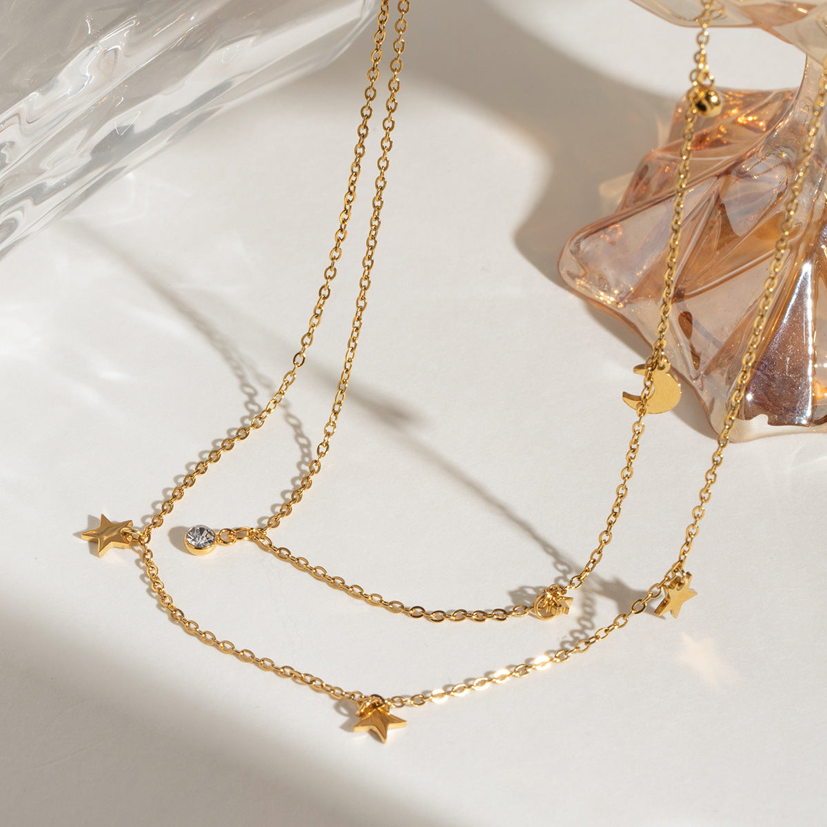 Damen Halskette mit funkelnden Stern- und Mondanhängern aus hypoallergenem Edelstahl Shop Nory