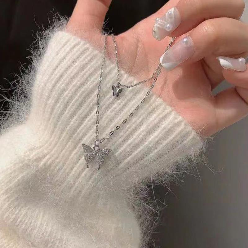 Damen Halskette mit funkelndem Schmetterlingsanhänger aus hochwertigem Edelstahl Shop Nory