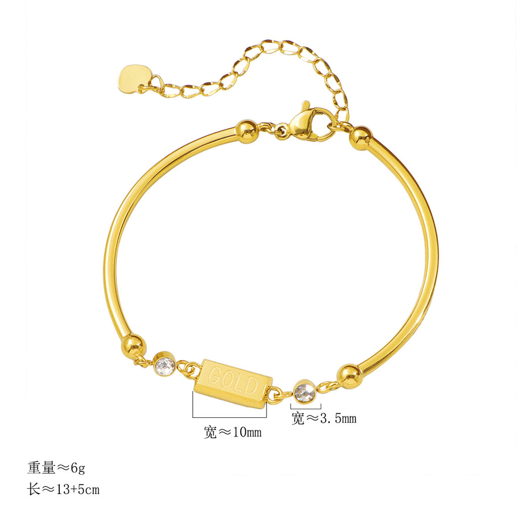 Damen Armband mit funkelnden Kristallakzenten und modernem GOLD-Anhänger Shop Nory