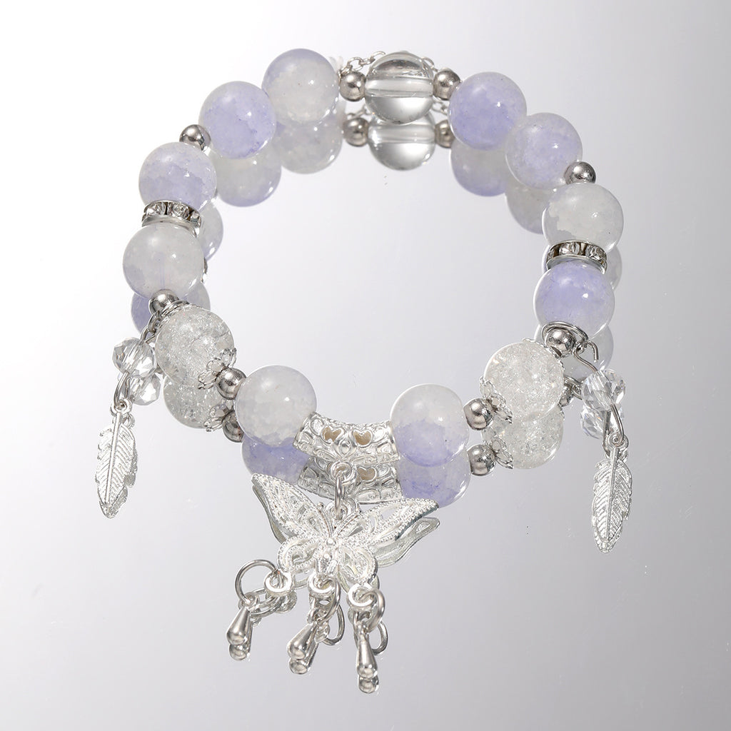 Damenarmband mit funkelnden Glaskugeln und filigranen Schmetterlingen Shop Nory