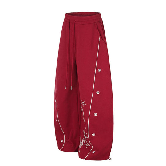 Damen Lockerfallende Palazzo‑Sweathose im Athleisure‑Look mit Tunnelzugbund und Script‑Print Shop Nory