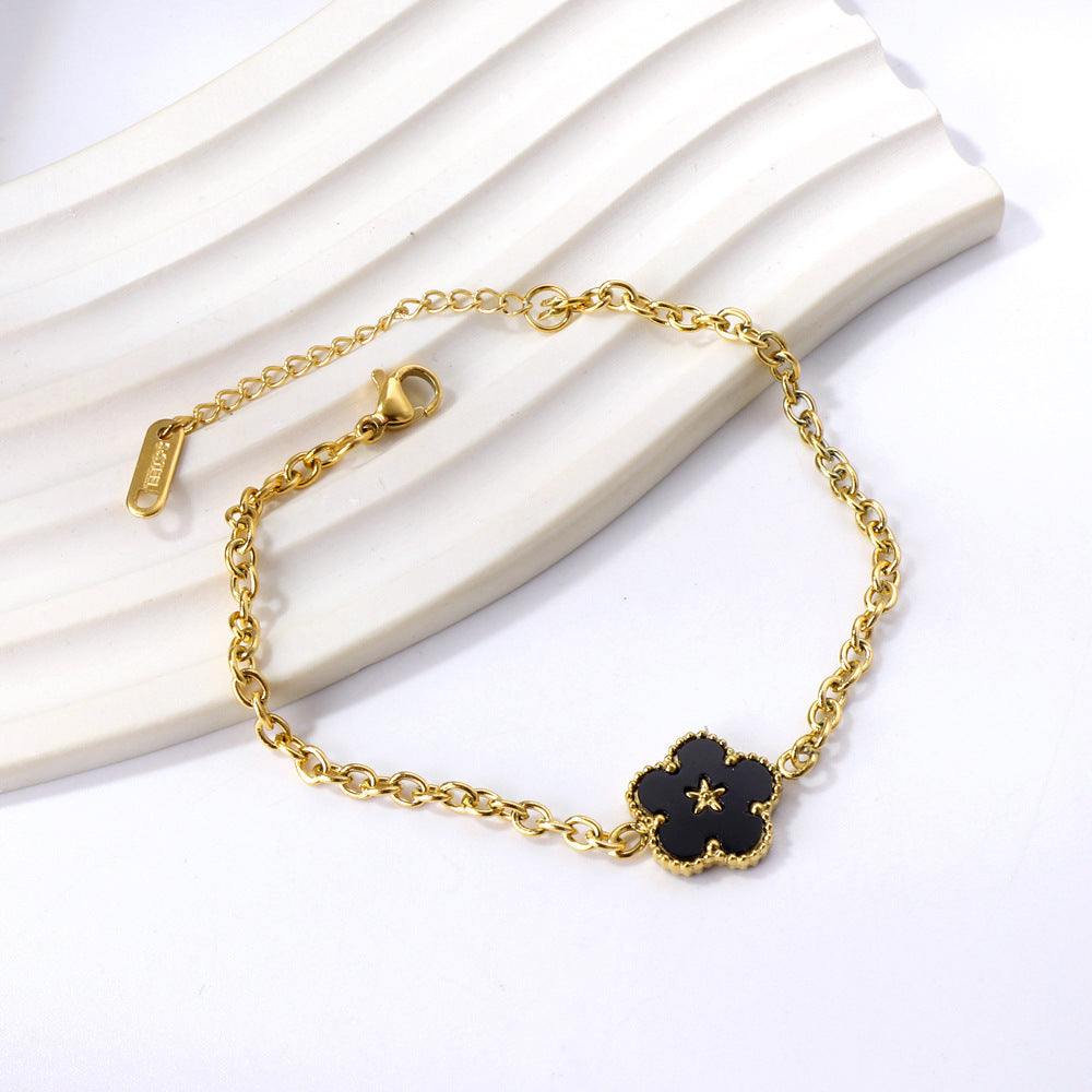 Damen Armband mit floralem Anhänger aus hochglanzpoliertem Edelstahl Shop Nory
